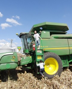 Kids on combine on farm