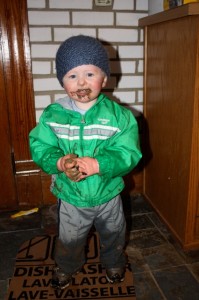 mud covered toddler